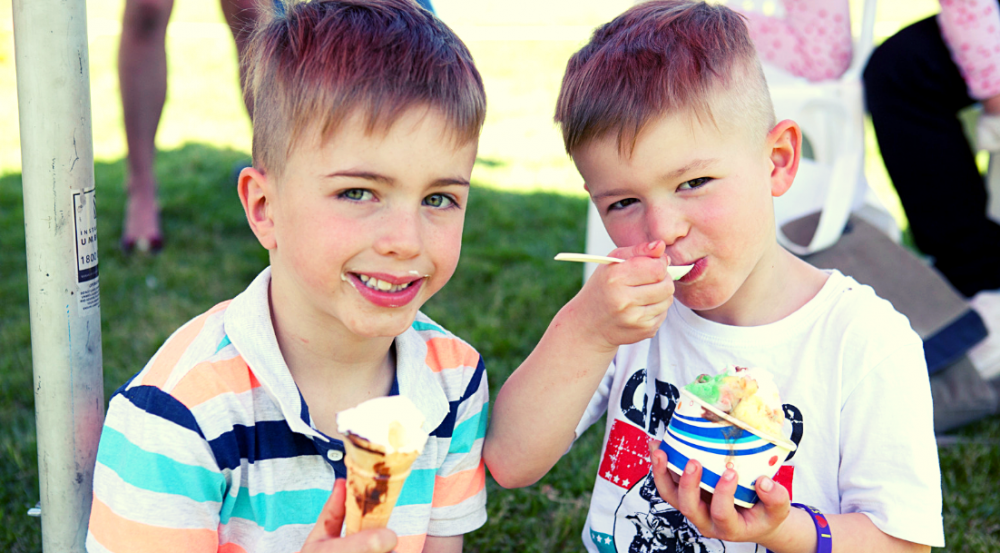 two young boys eating ice cream