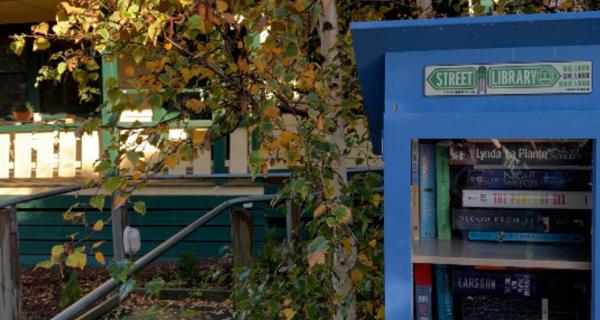 Neighbourhood house with street library at front