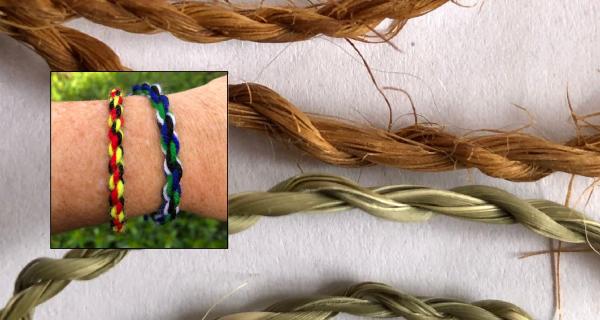 Arm with two hand made friendship bracelets