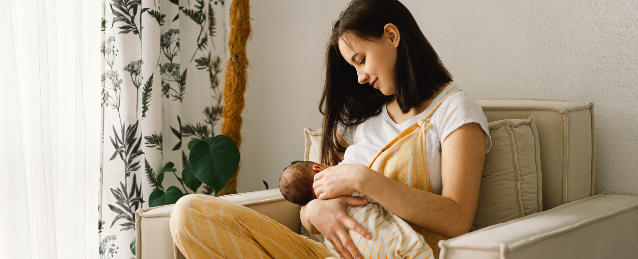Mother breastfeeding babe