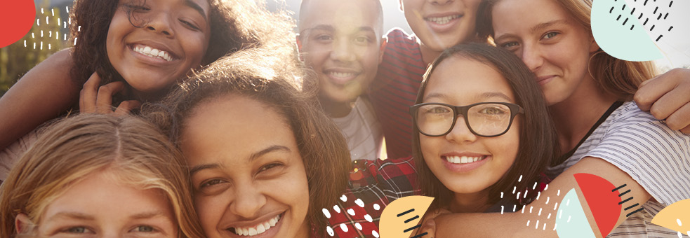Teens, smiling in a group photo