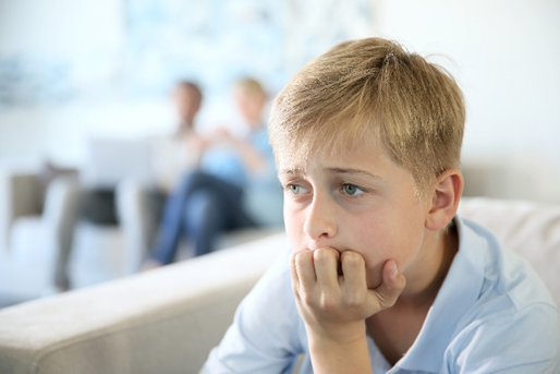 Young boy looking concerned