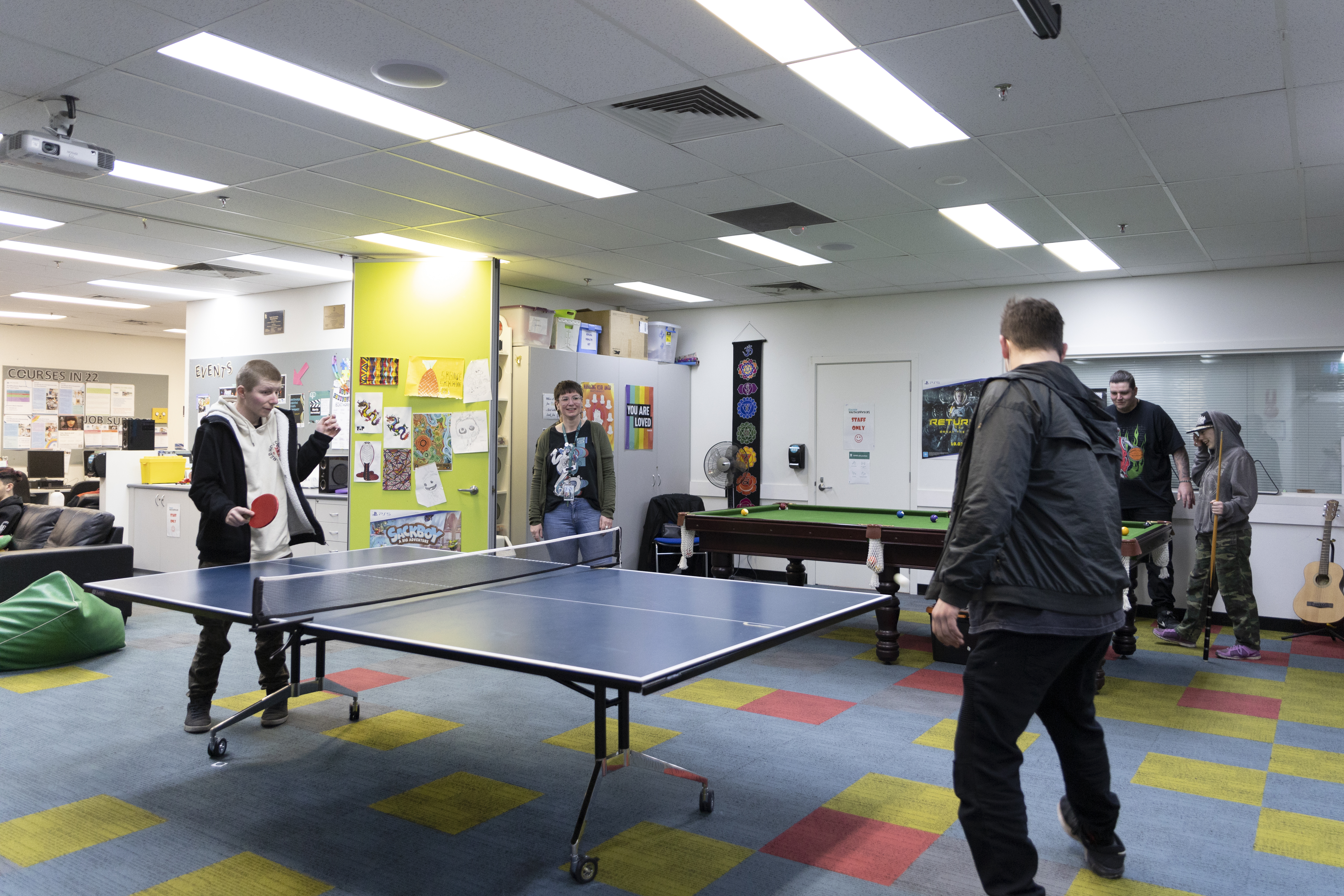 Young people playing table tennis