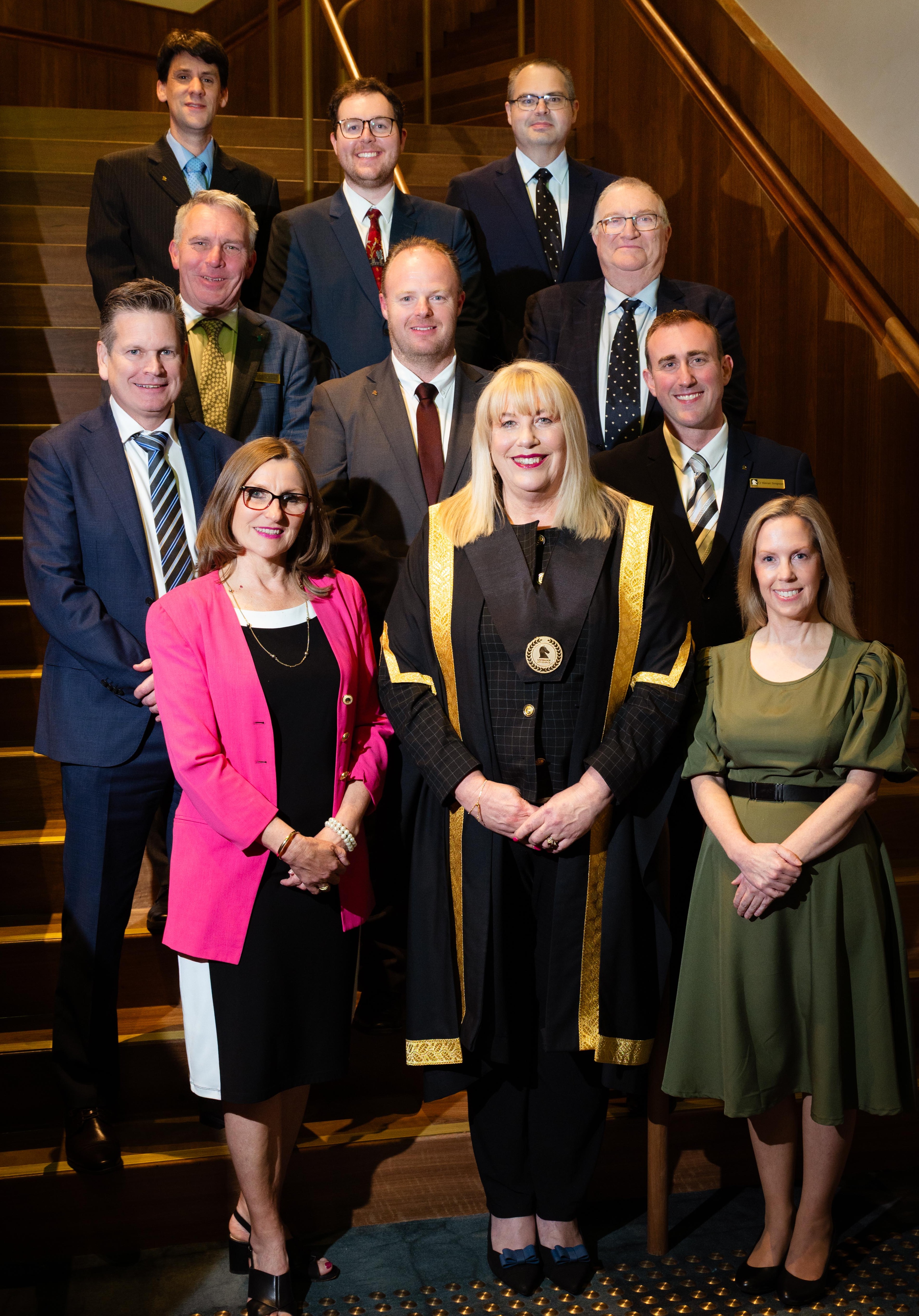 Whitehorse City Councillors standing in rows of three on a stairway