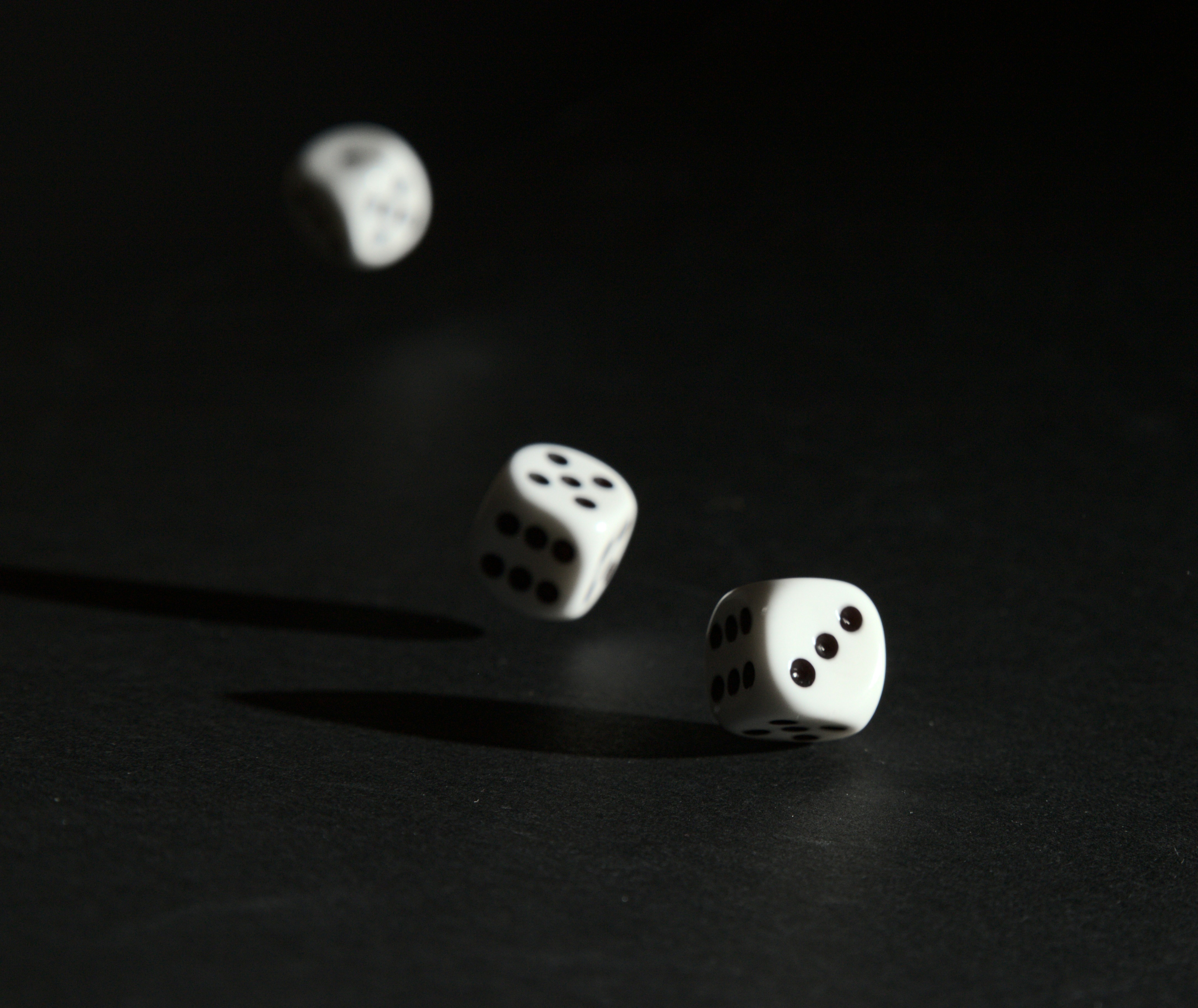 Three dice on a black background