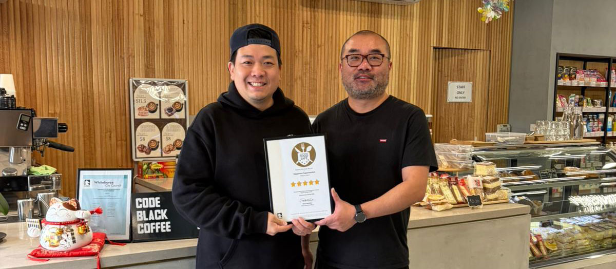 owners of Happinest Supermarkets with their 5 star certificate