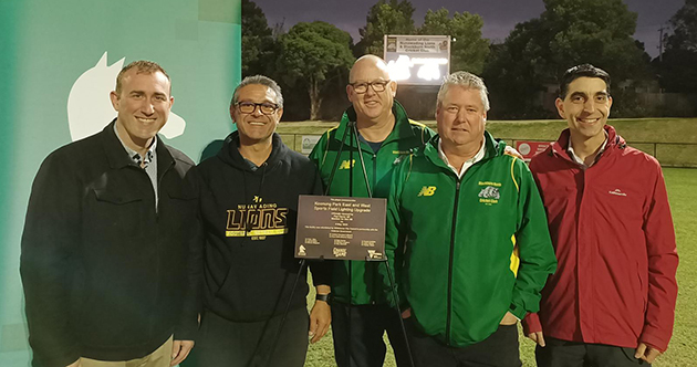 Group photo at celebration following installation of new scoreboard and sports lighting
