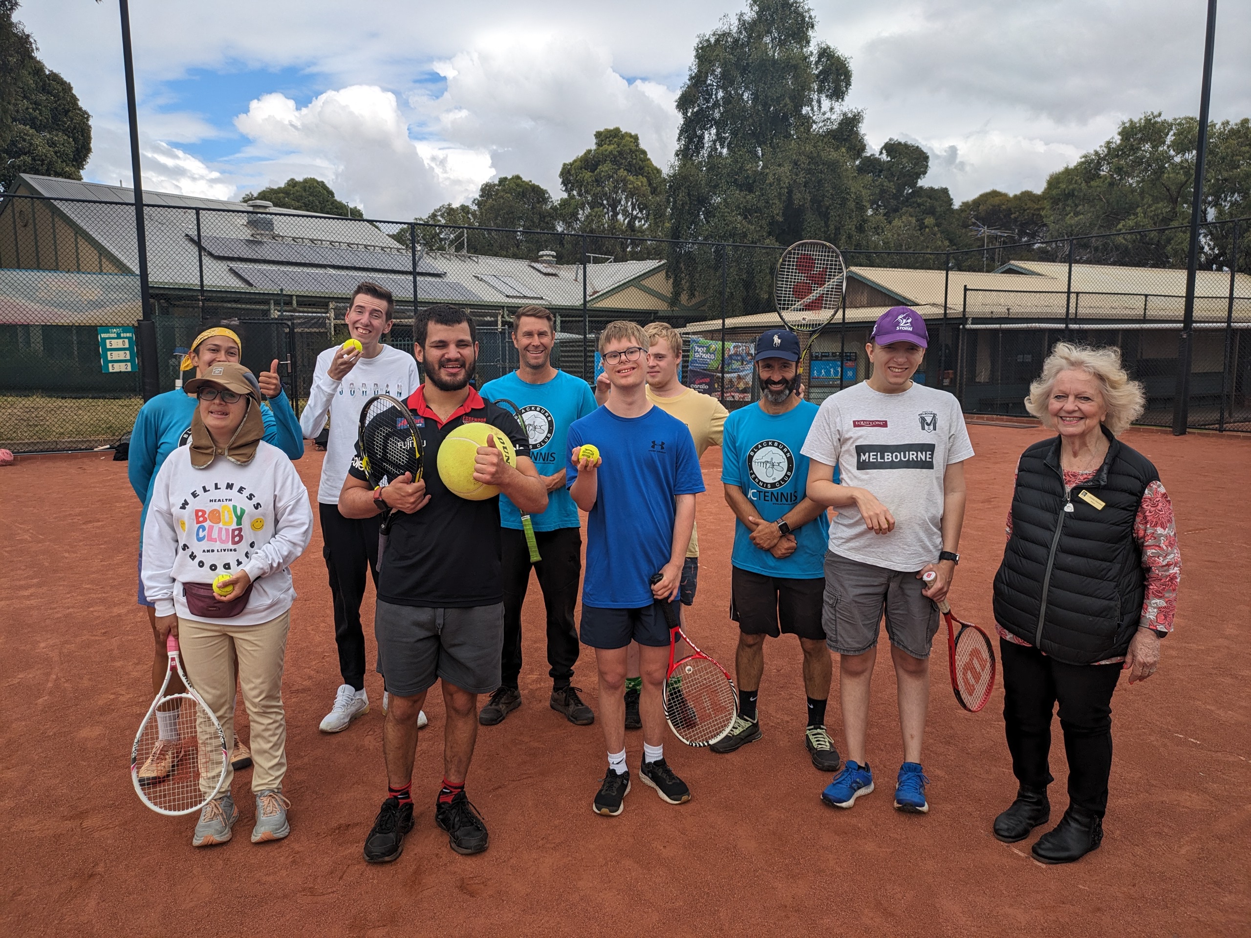 Cr Massoud with players at the Blackburn Tennis Club as part of its all abilities program.