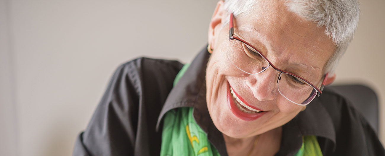 Senior lady with glasses on smiling