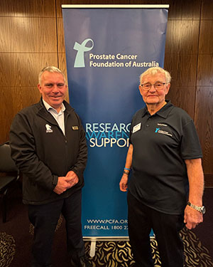 Cr Barker with a community member at research support