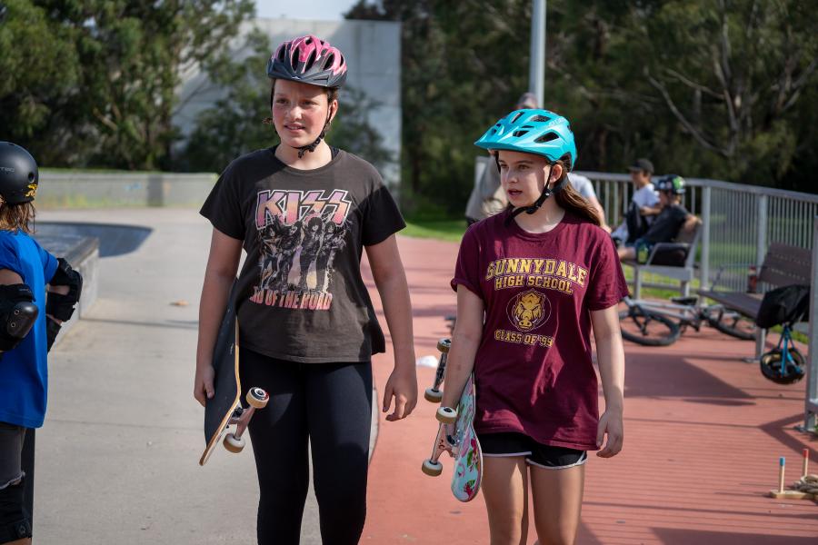 Two young people enjoying Youth Connexions outreach at skate park