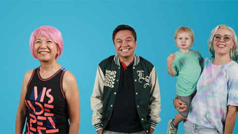 3 adults and 1 baby looking at the camera