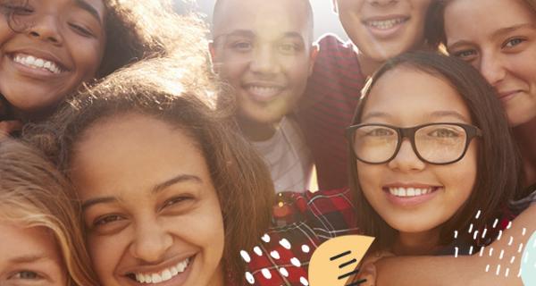 Teens, smiling in a group photo