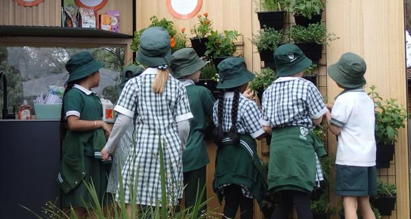 Picture of school children exploring a tiny house