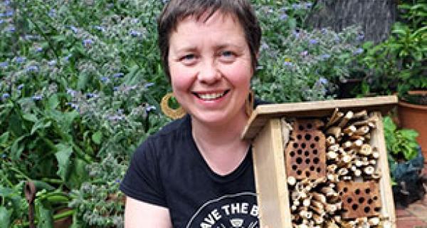 Katrina Forstner with bee hives