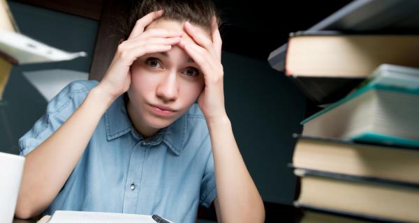 Student looking overwhelmed with homework