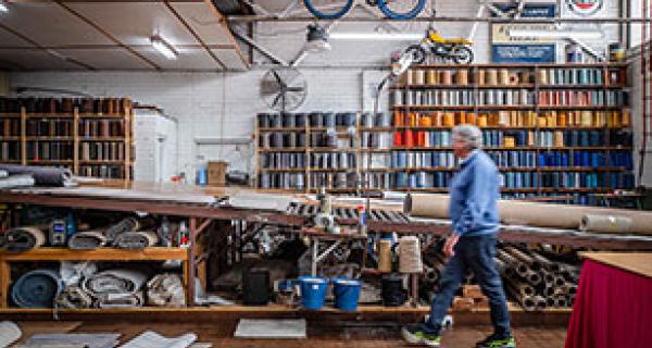 man working in textiles workshop