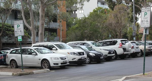 row of cars parked in car park