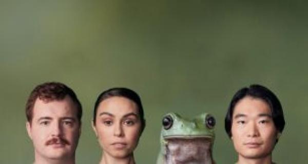 three people and a frog