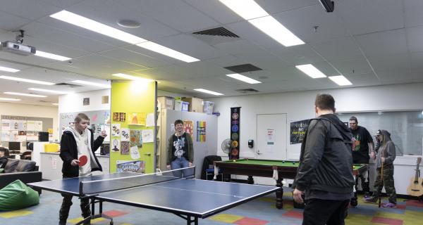 Young people playing table tennis