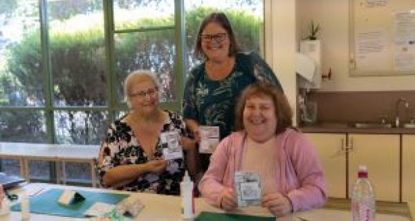 three people doing craft 