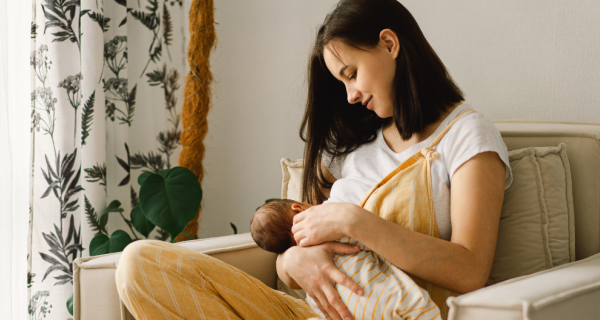 Mother breastfeeding babe