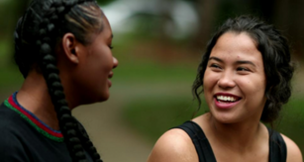 Two young women sharing a laugh