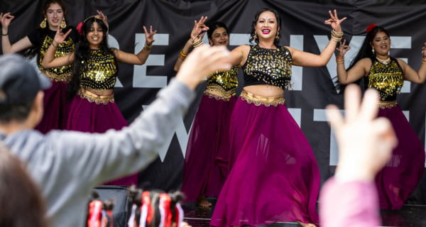 group of women dancing in costume