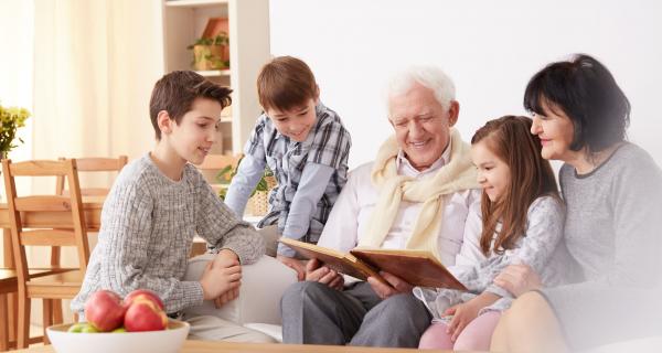 Grandparents reading with their grandchildren