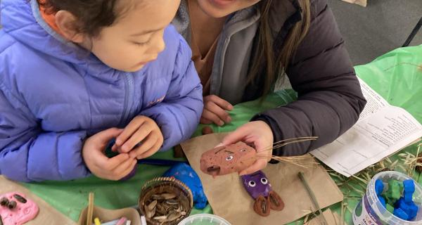Child and mother making nature crafts