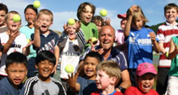 Group of children throwing balls