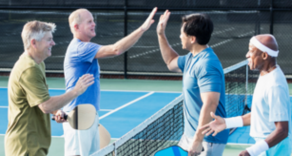 Men's Health Week image - four men playing pickleball