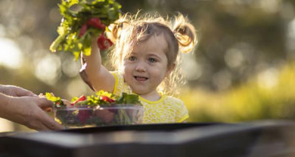 Image of child with compost bin
