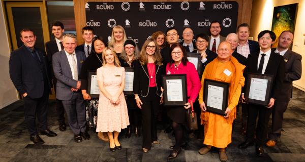Award recipients holding their certificates