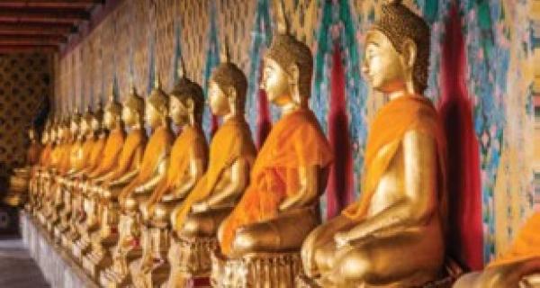 Gold and orange Buddha in a row