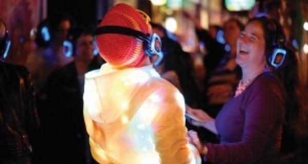 Silent Disco people dancing with headphones on