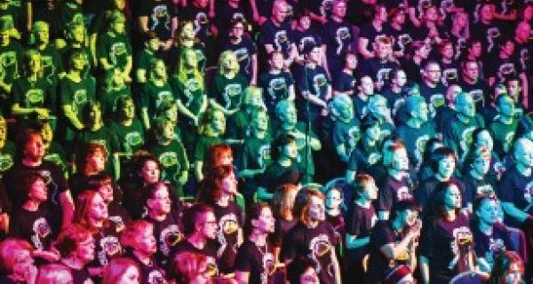 Choir group sing with rainbow lighting filter on top