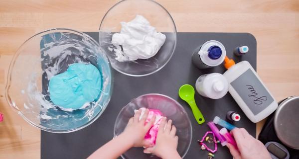 kids playing with different coloured slime