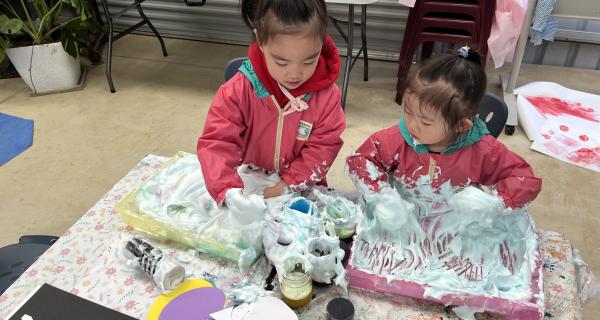 two children crafting/playing