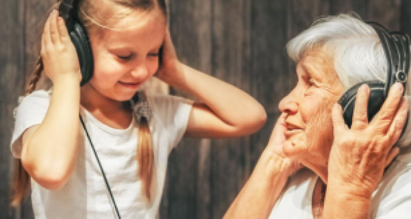 Child and Grandmother listening to music