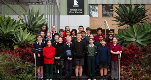 young students standing outside