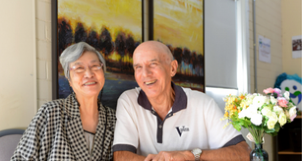 male and female seniors smiling 