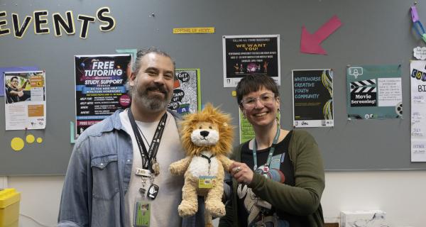 Friendly staff with Lion mascot at Youth ConneXions