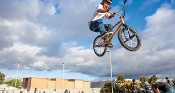 Photo of boy at skate park on bike