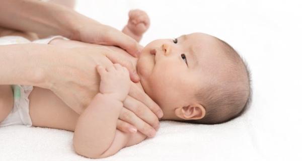 Young baby lying on their back
