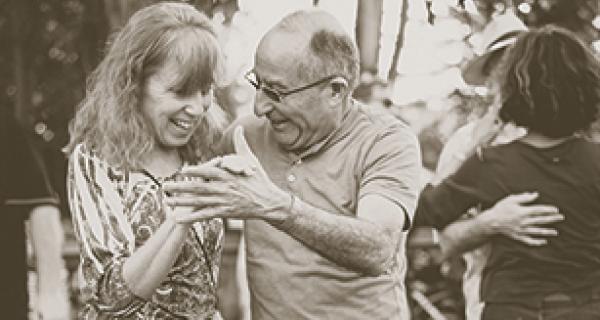 Black and white photo of older couple dancing 