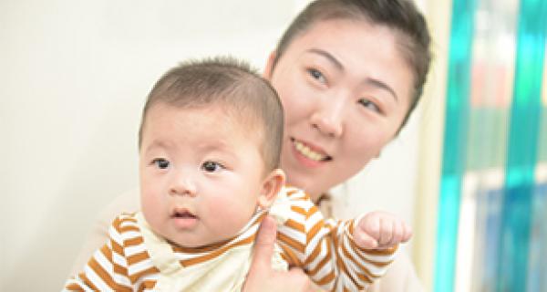 a young Asian mother and her baby