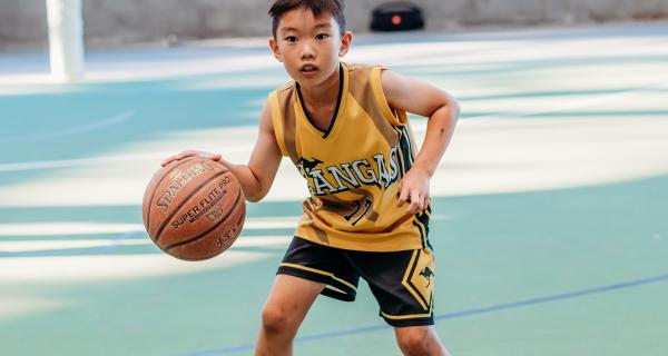 Young boy playing basketball 