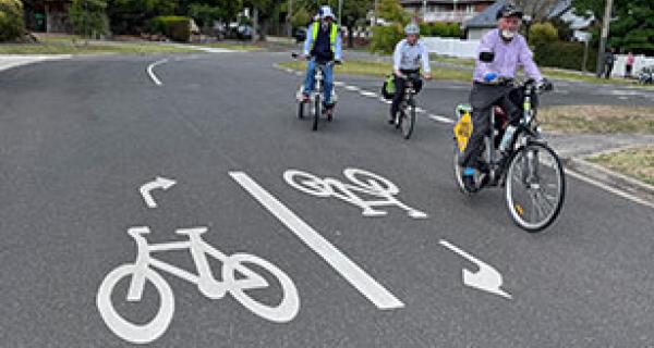 easy ride route markings and 3 people on bikes