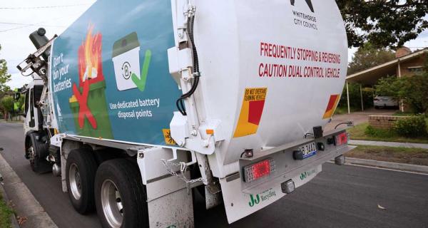 Photo of garbage truck on suburban street